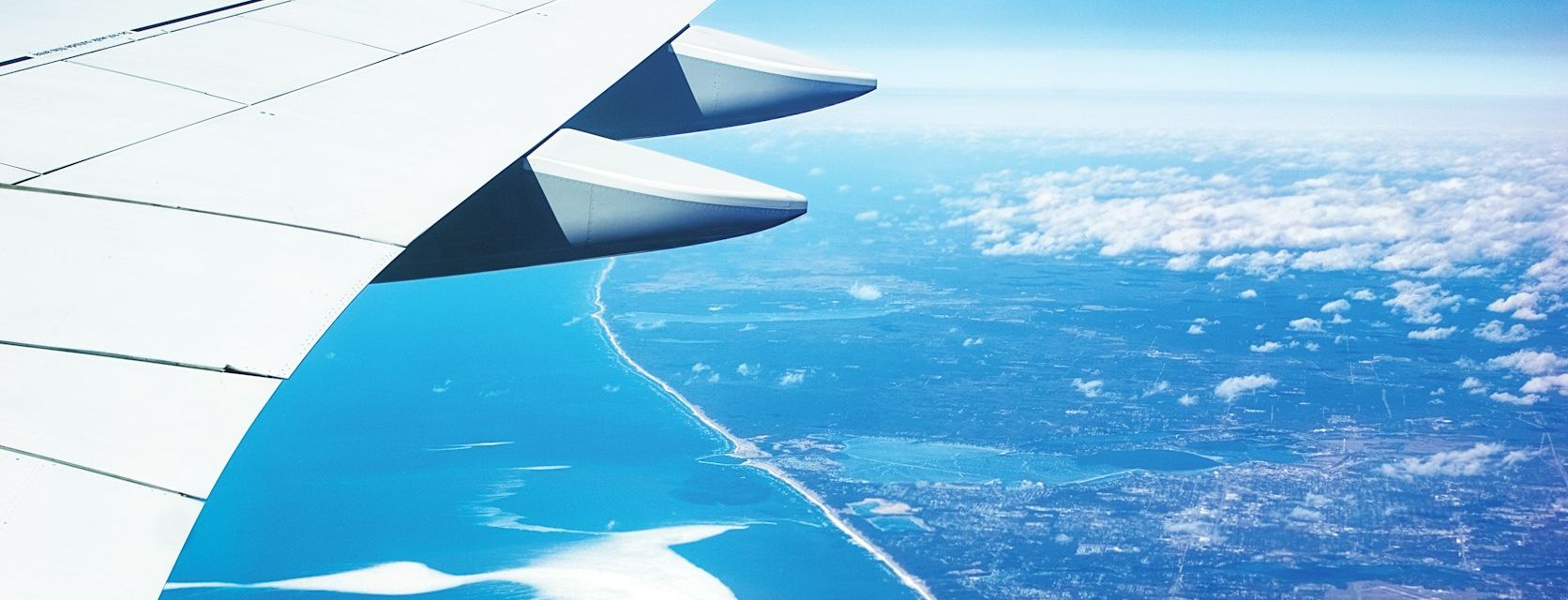 Airliner wing with flap track fairings seen from above