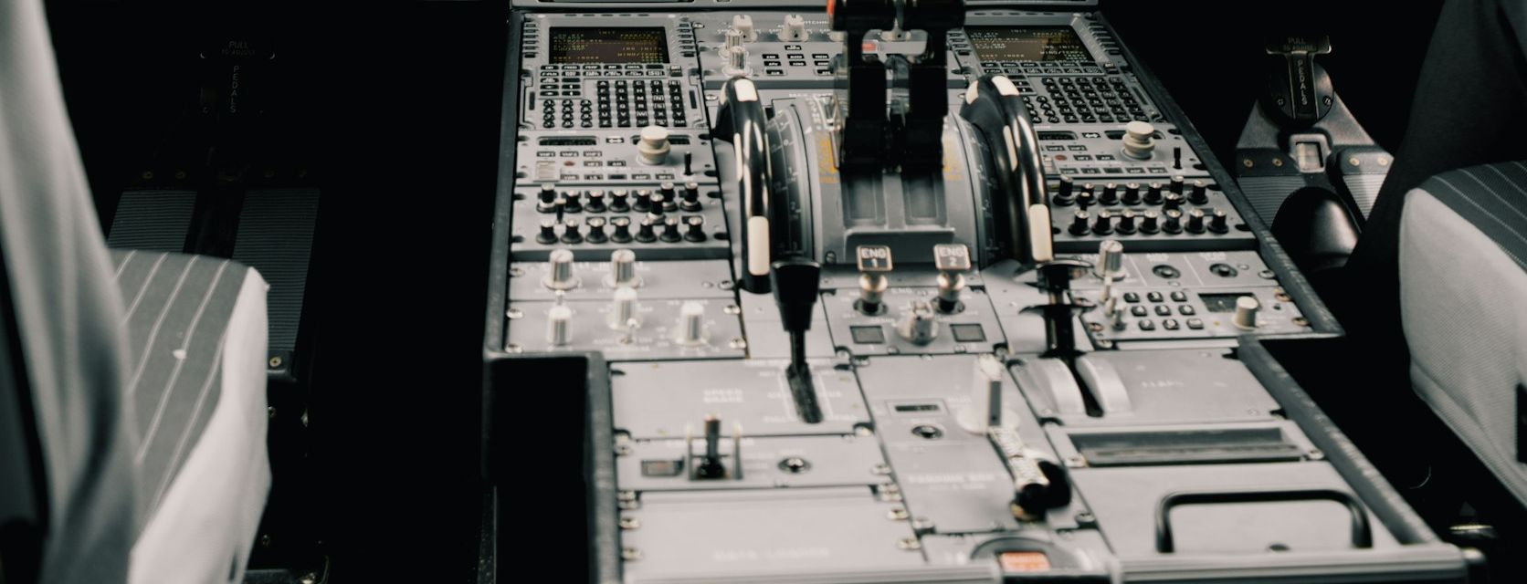 Airliner cockpit centre console and flight-deck displays