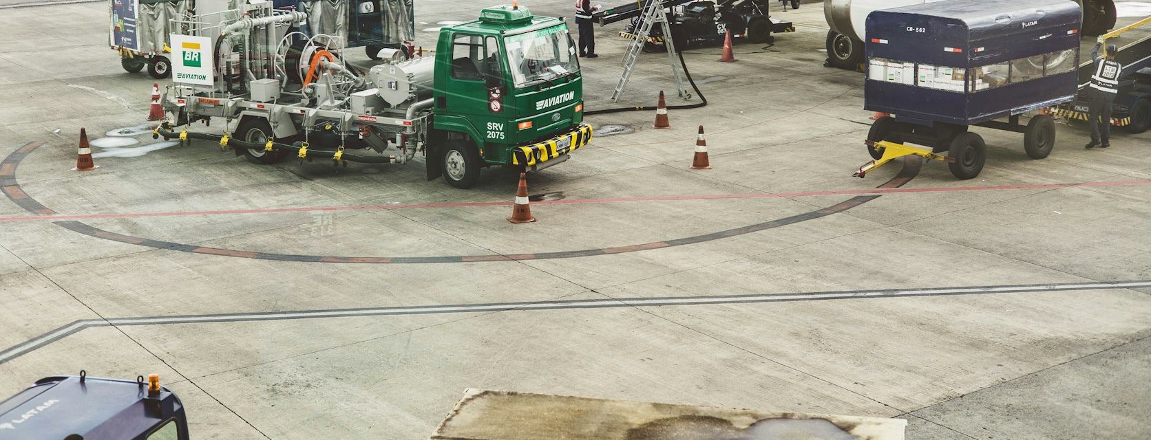 Refuelling truck servicing an aircraft on the apron